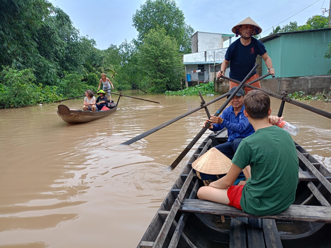 Multiple canoes on waterway