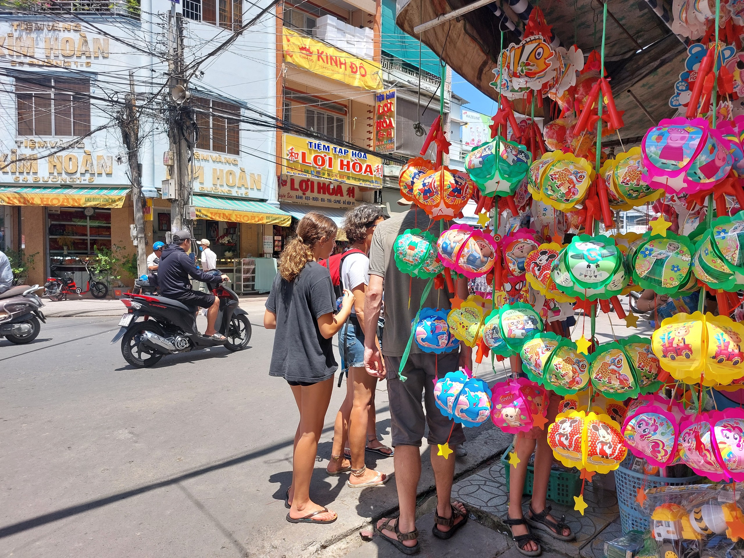 Wet market street with lanterns