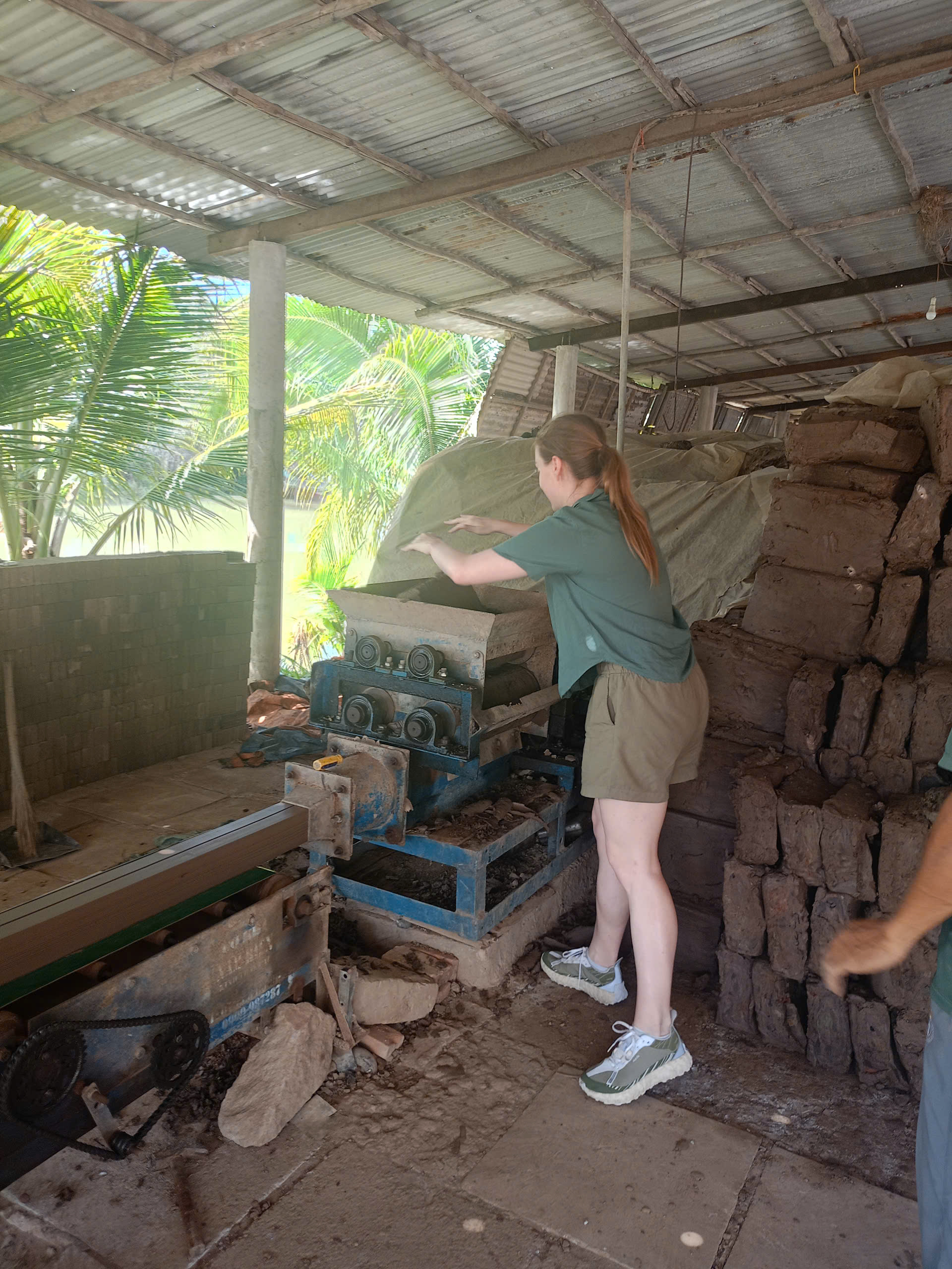 Pressing bricks by hand