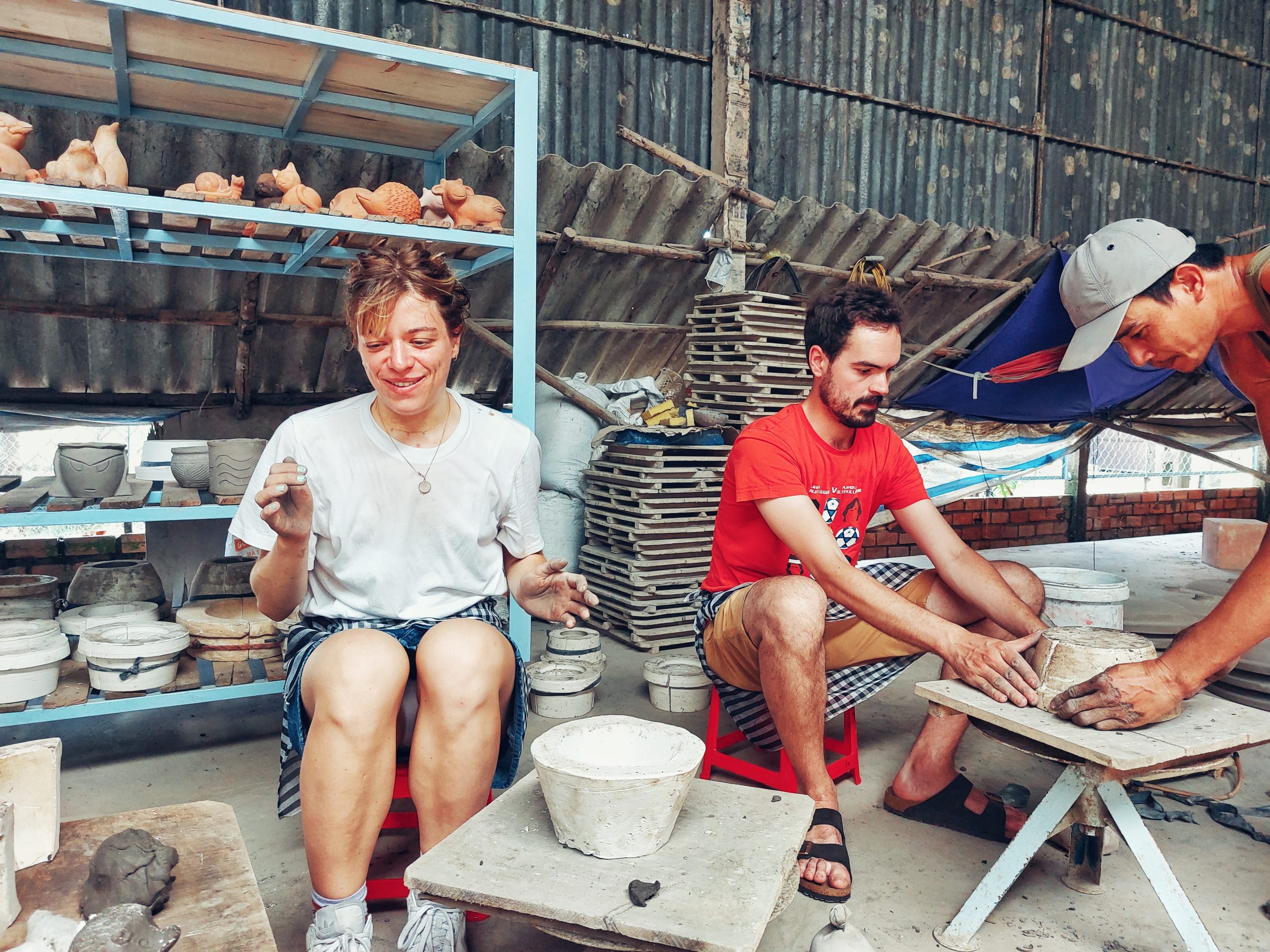 Shaping clay on the pottery wheel
