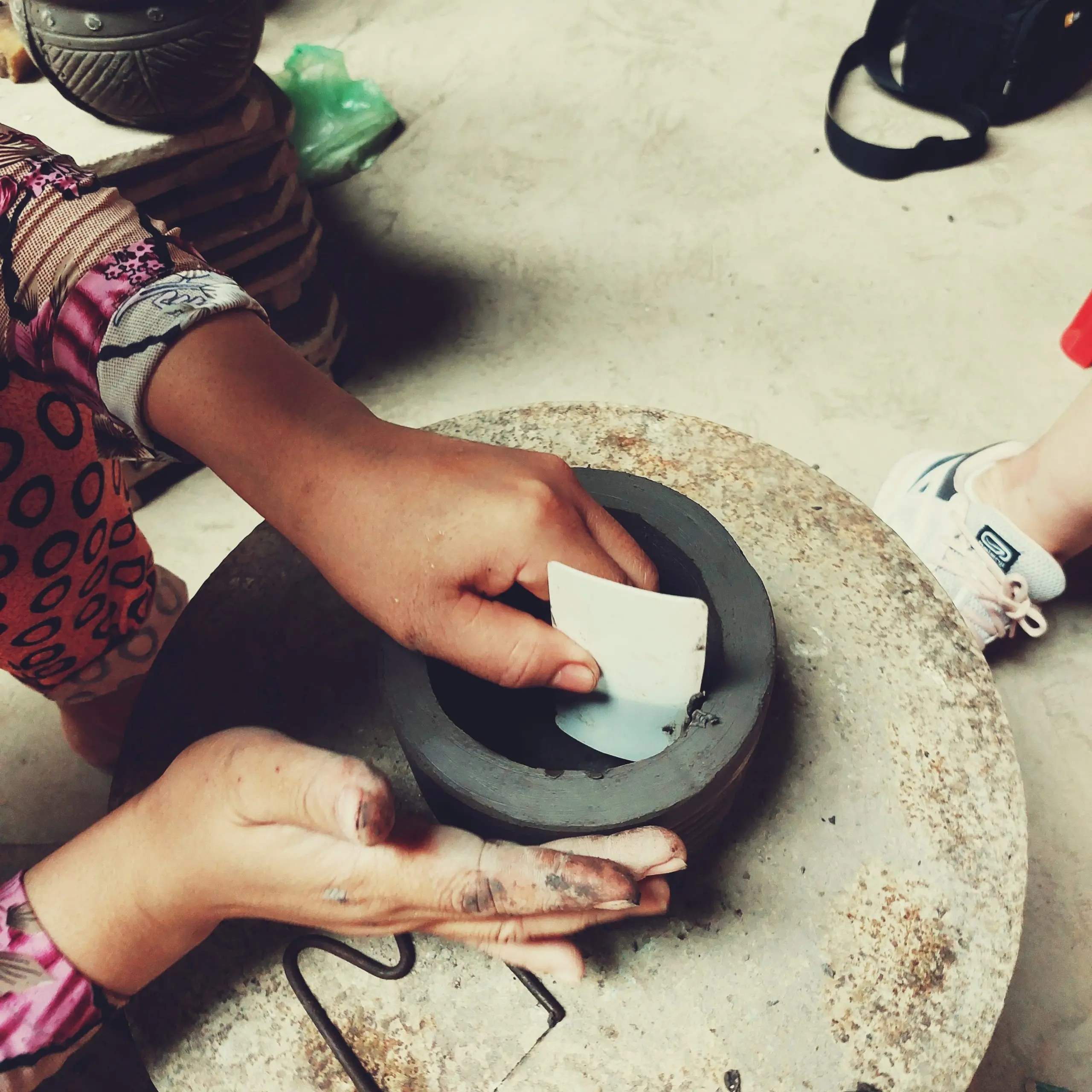 Shaping a clay bowl
